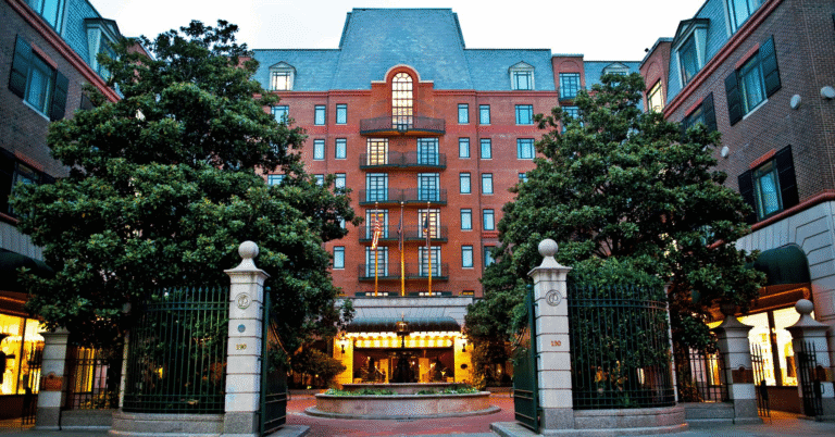 Charleston Place hotel exterior with a Lowcountry Luxury Limo vehicle