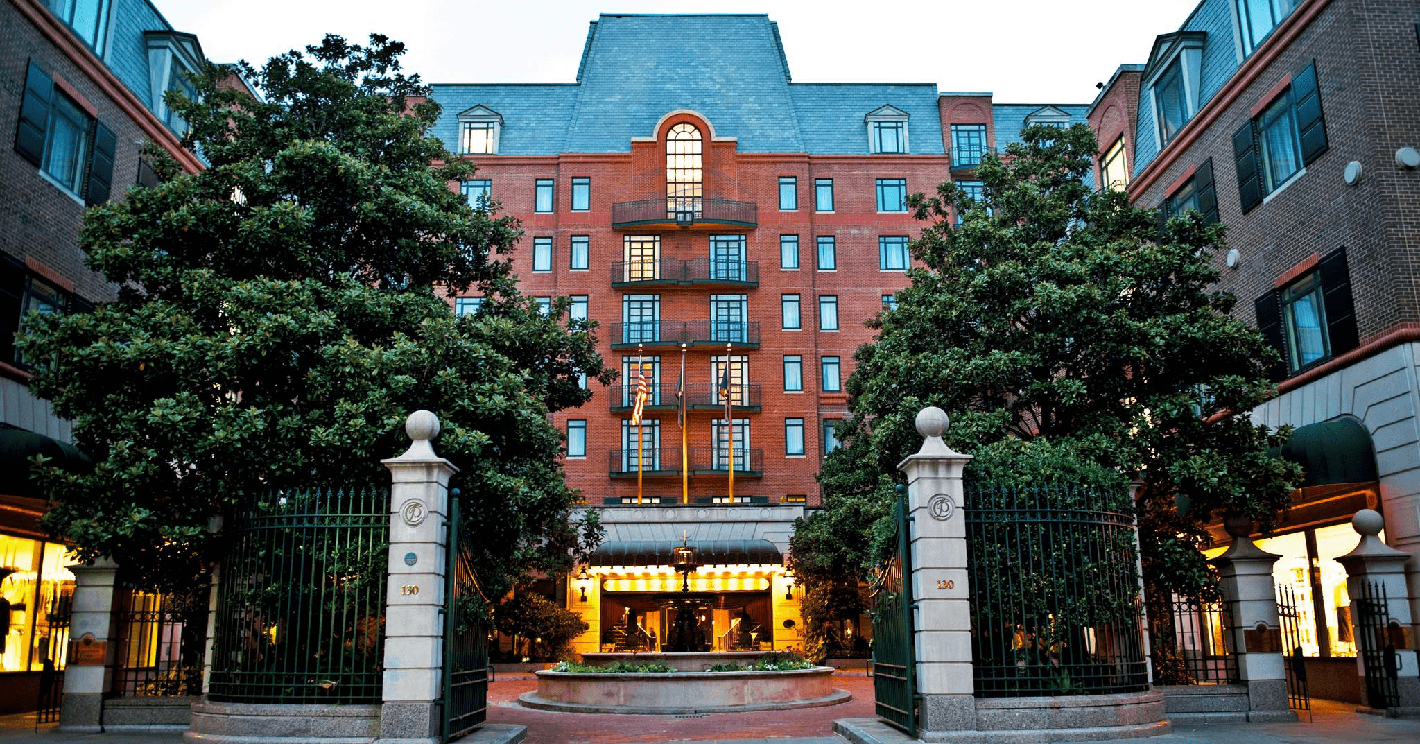 Charleston Place hotel exterior with a Lowcountry Luxury Limo vehicle